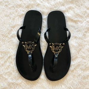 Michael Kors black jelly sandals with gold logo